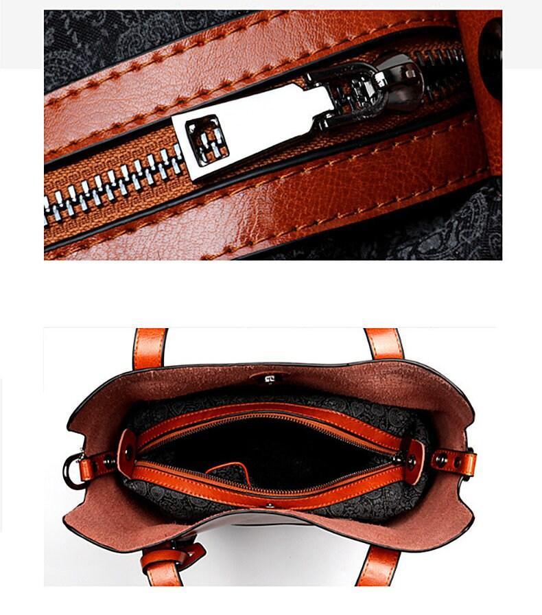 Brown leather tote shoulder bag with zipper detail and spacious patterned interior