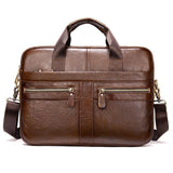 Brown leather laptop shoulder bag with dual handles, front zippered pockets, and detachable strap