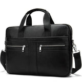 Black leather shoulder laptop bag with dual top handles, two front zip pockets, and adjustable strap