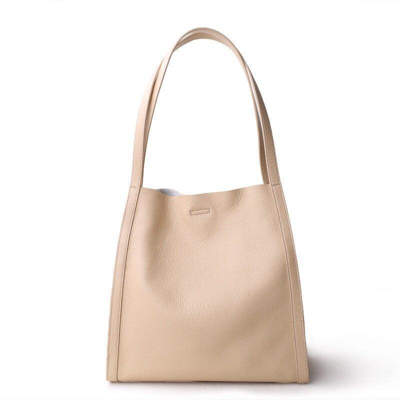 Beige grain cowhide leather tote bag with minimalist design and double shoulder straps