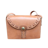 Small handcrafted leather shoulder bag with stitched flap and brass button closure